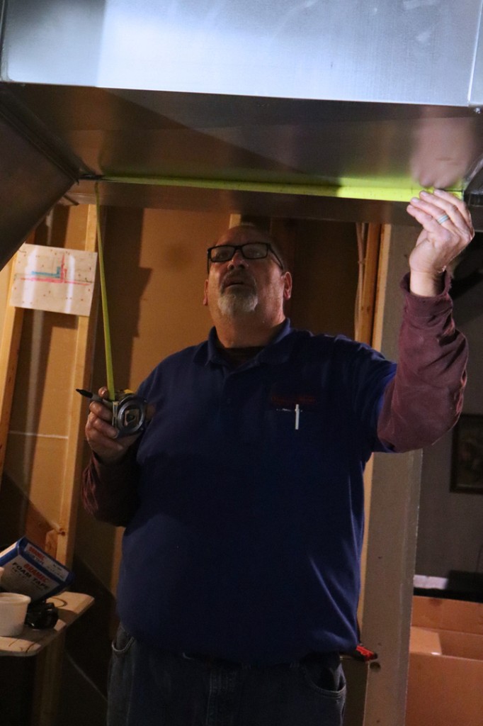 Midwest Comfort technician installing ductwork