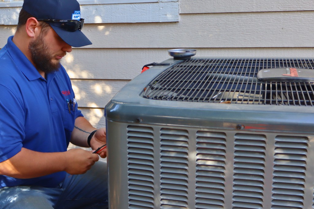 Residential outdoor AC unit serviced by Midwest Comfort
