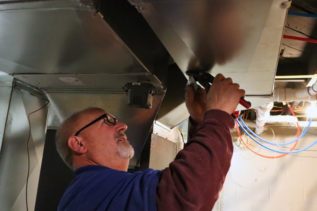 Ductwork installation in a Des Moines-area home by Midwest Comfort