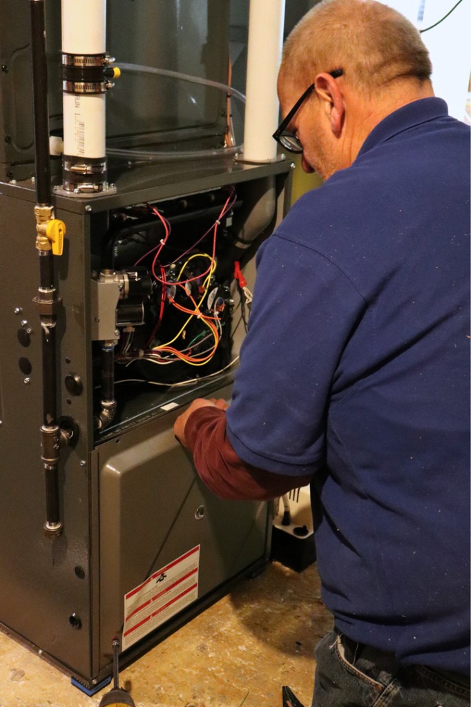 Midwest Comfort technician on an emergency furnace repair call